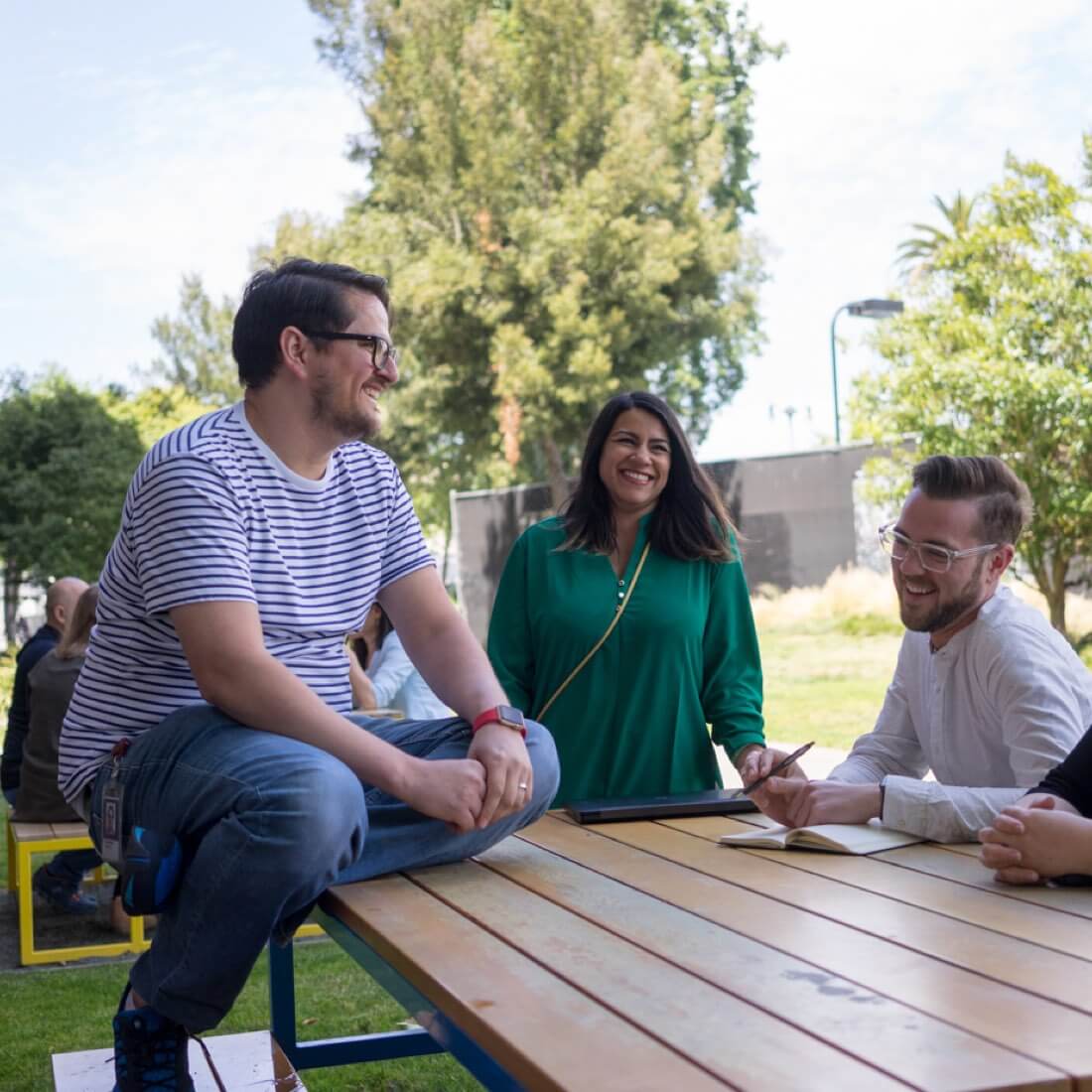 Esurance employees sitting at picnic table