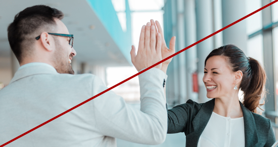 photo of man and woman giving high five