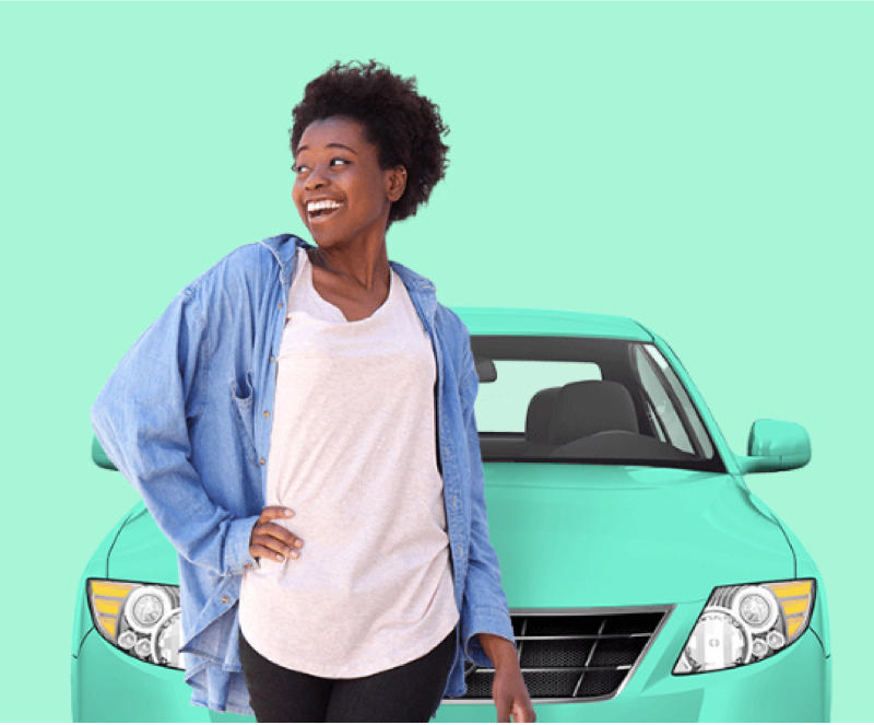 photo of a woman standing in front of a car